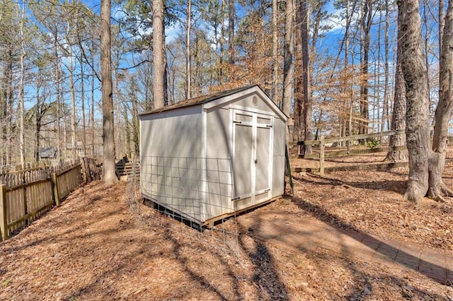 view of shed with fence