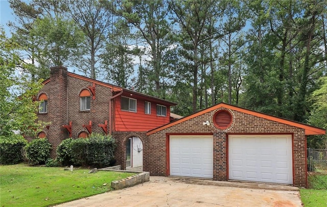 view of front of home with a garage and a front lawn