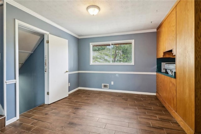 interior space with crown molding and dark hardwood / wood-style flooring