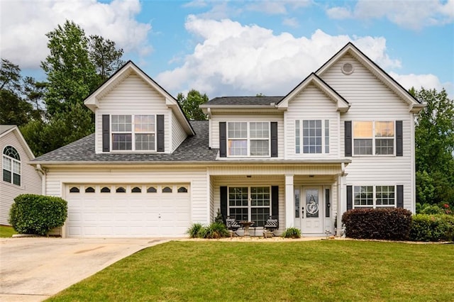 7282 Litany Ct, Flowery Branch, GA 30542 - traditional-style home featuring a porch, driveway, a front yard, and a shingled roof