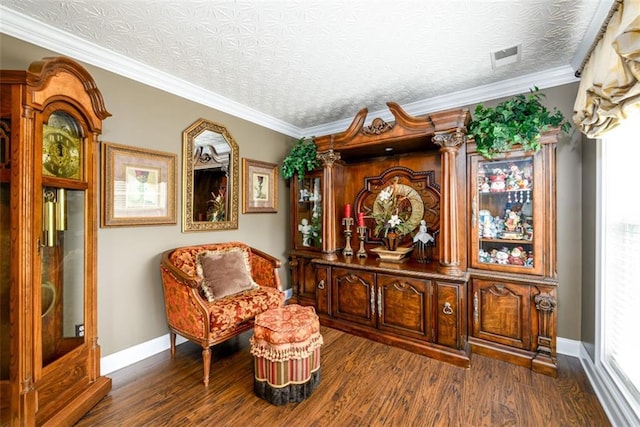 7282 Litany Ct, Flowery Branch, GA 30542 - living area featuring dark wood finished floors, baseboards, and ornamental molding