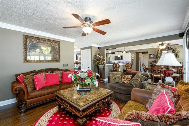 7282 Litany Ct, Flowery Branch, GA 30542 - living area with a ceiling fan, wood finished floors, baseboards, and crown molding