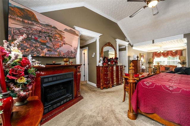 7282 Litany Ct, Flowery Branch, GA 30542 - carpeted bedroom with vaulted ceiling, a fireplace, crown molding, baseboards, and a ceiling fan