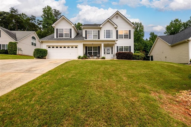 7282 Litany Ct, Flowery Branch, GA 30542 - traditional-style home with driveway, a front lawn, and a porch
