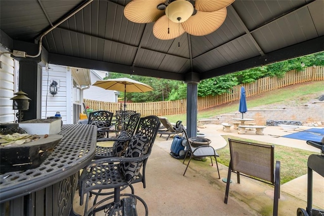7282 Litany Ct, Flowery Branch, GA 30542 - view of patio with ceiling fan and outdoor dining space