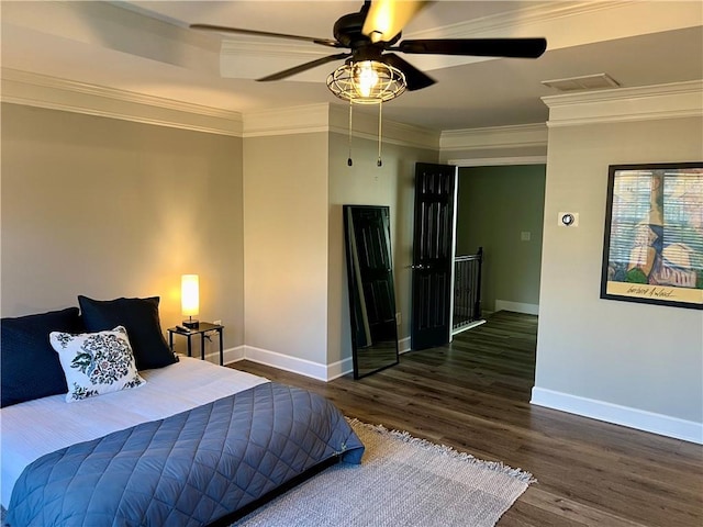 bedroom featuring dark wood-type flooring, ceiling fan, and crown molding