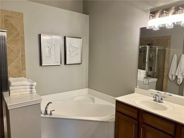 bathroom with vanity and independent shower and bath