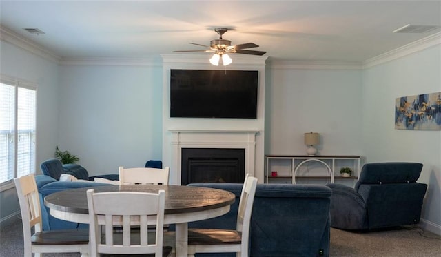 interior space featuring crown molding, carpet, and ceiling fan