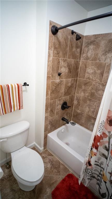 bathroom with shower / tub combo and toilet