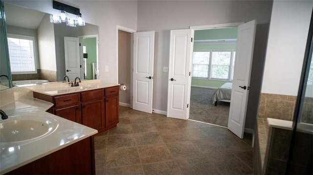 bathroom with tile patterned flooring and vanity