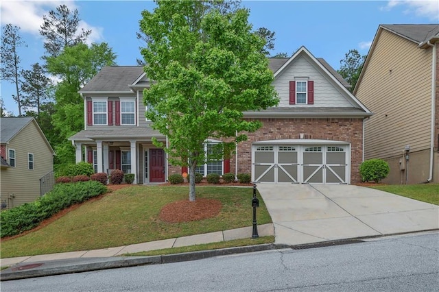 view of front of house with a front yard and a garage