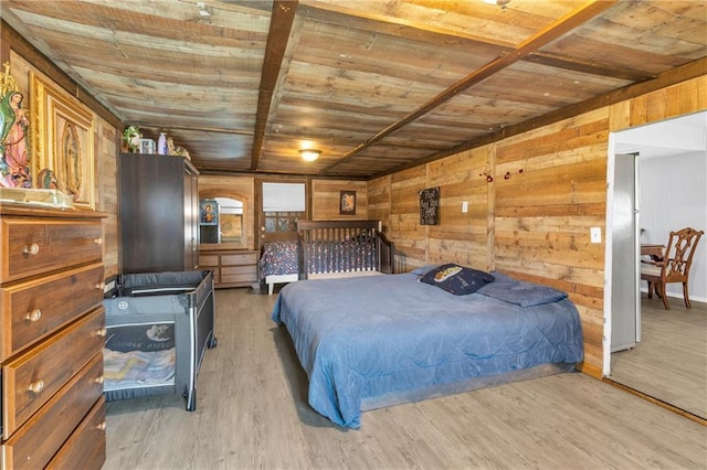 bedroom with light wood finished floors, wood walls, and wood ceiling