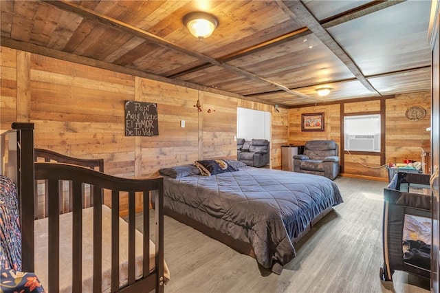 bedroom featuring wooden ceiling, wooden walls, and wood finished floors