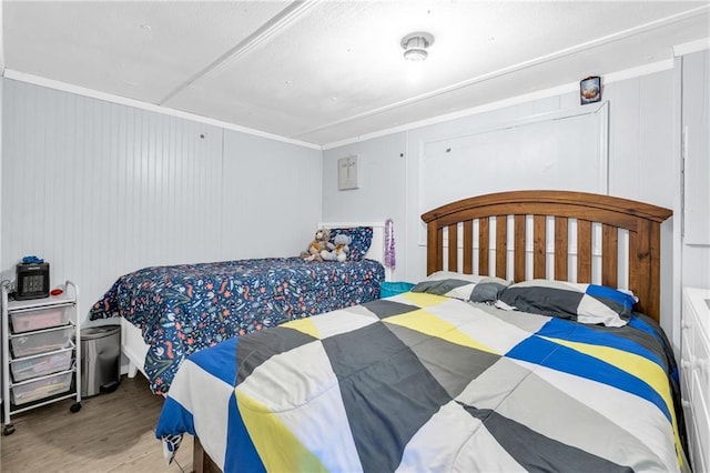 bedroom featuring wood finished floors