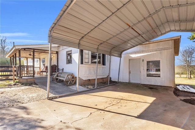 exterior space featuring a carport and driveway