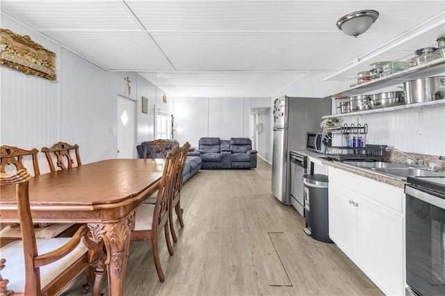 dining area with light wood finished floors