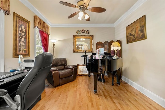 home office featuring ceiling fan, light wood finished floors, baseboards, and crown molding