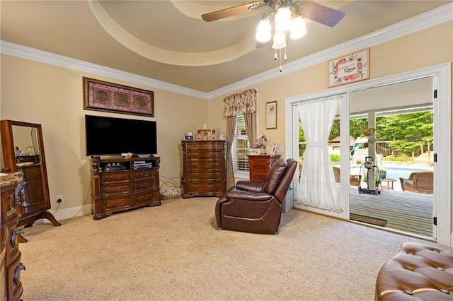 sitting room featuring carpet, ornamental molding, and baseboards