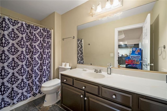 ensuite bathroom featuring toilet, vanity, and ensuite bathroom