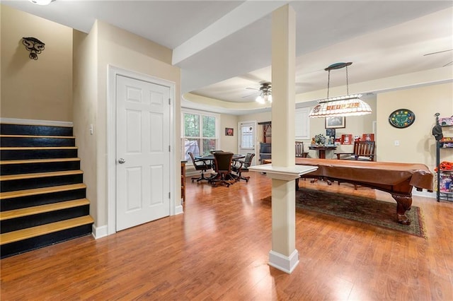 playroom featuring ceiling fan, pool table, baseboards, light wood-type flooring, and a tray ceiling