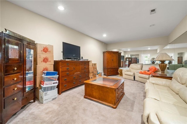 living room with light carpet, visible vents, and recessed lighting