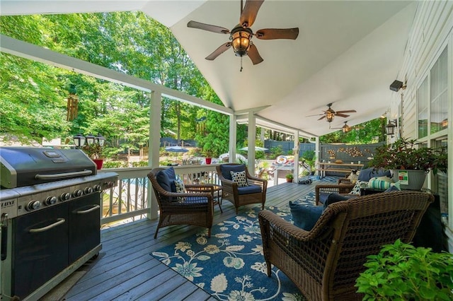 wooden terrace featuring area for grilling, ceiling fan, an outdoor hangout area, fence, and outdoor dining area