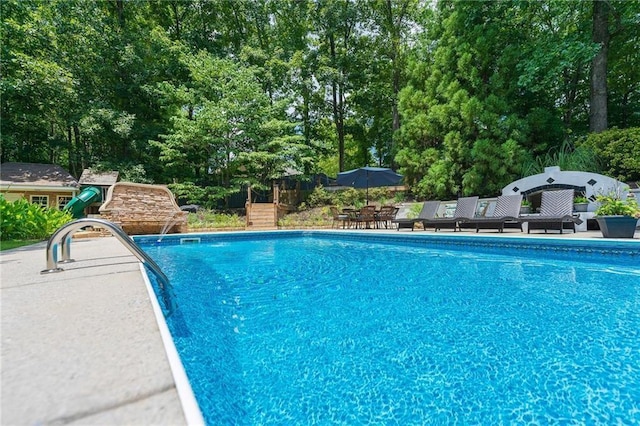 pool with a patio area