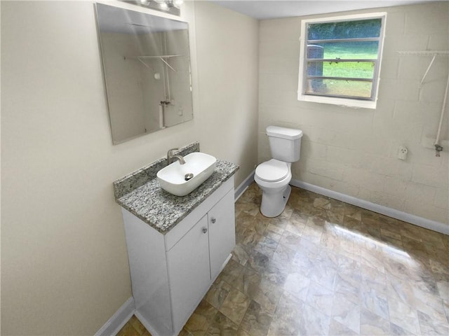 bathroom with tile patterned floors, vanity, and toilet