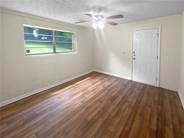 spare room featuring hardwood / wood-style floors, a textured ceiling, and ceiling fan