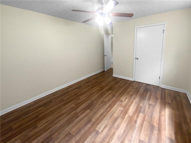 spare room featuring ceiling fan and hardwood / wood-style flooring