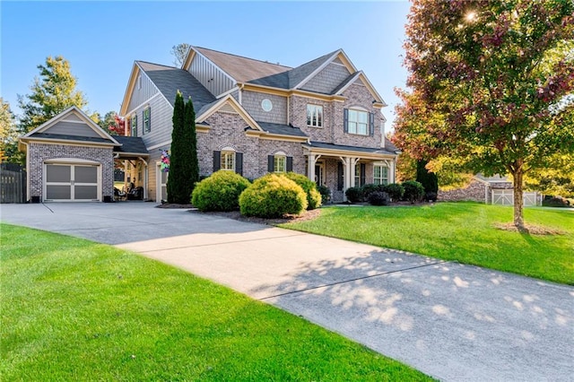 craftsman-style home featuring a front lawn and a garage