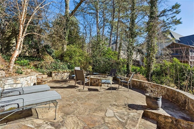 view of patio / terrace with an outdoor fire pit