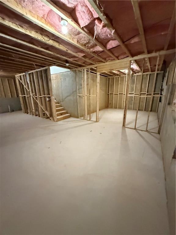 unfinished basement with stairs