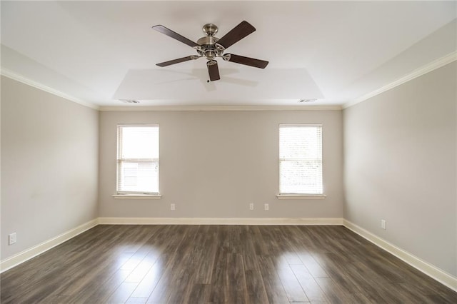 spare room with visible vents, dark wood-style flooring, and crown molding