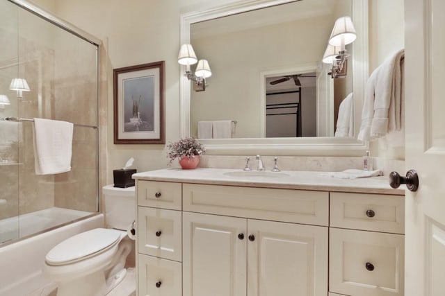 full bathroom with toilet, combined bath / shower with glass door, and vanity