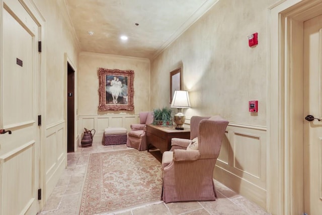 living area featuring ornamental molding and light tile flooring