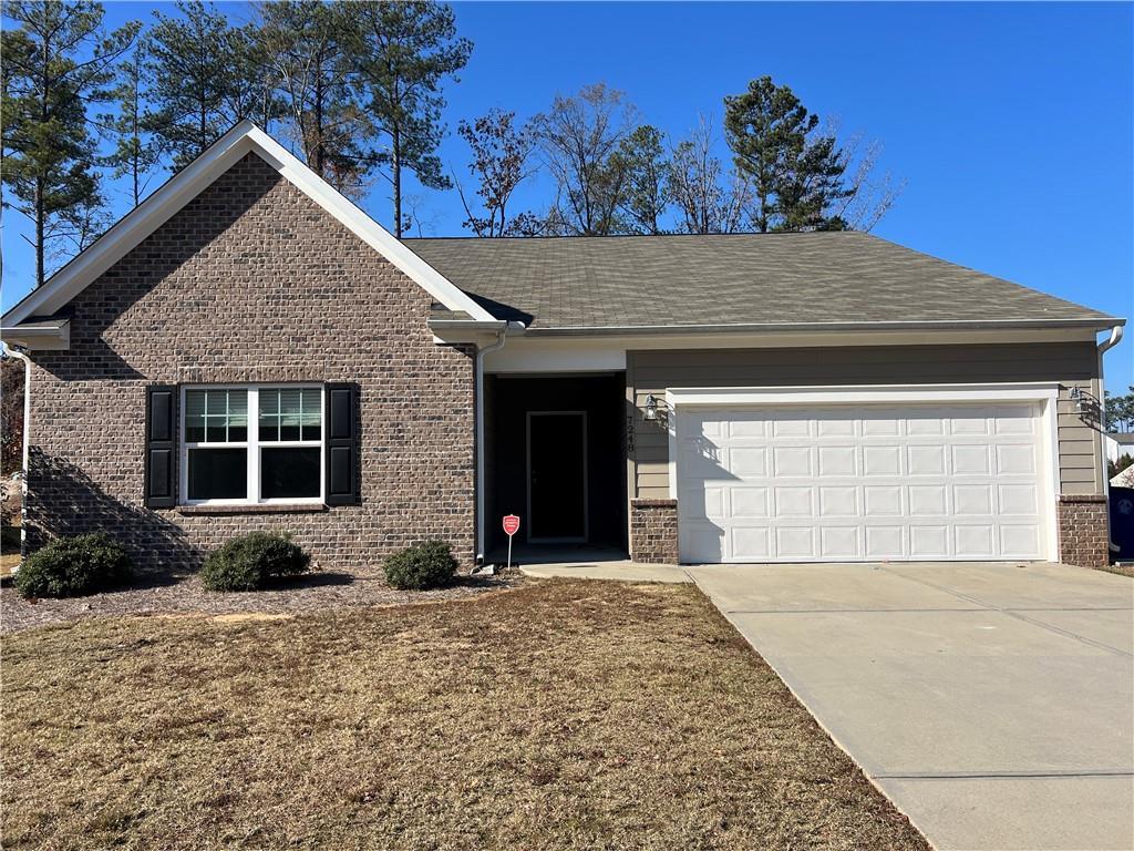 ranch-style home with a garage