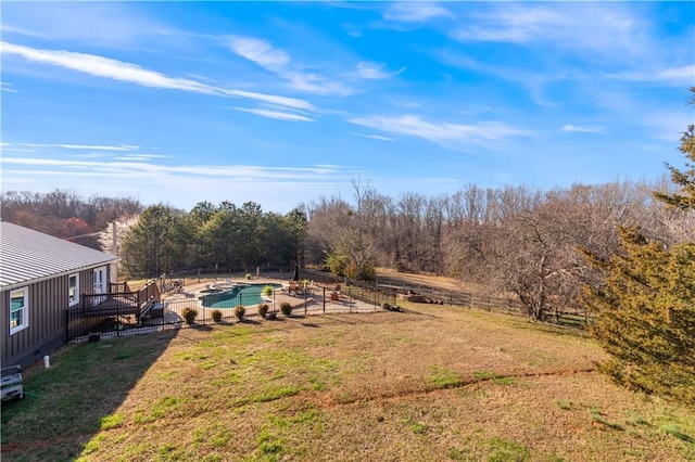 view of yard featuring a fenced in pool and fence