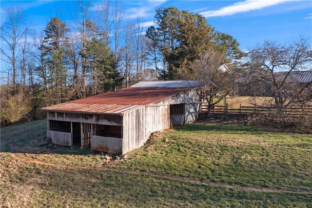 view of pole building with a yard