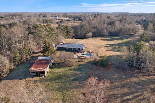 aerial view featuring a rural view and a view of trees