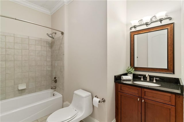 full bathroom featuring toilet, ornamental molding, tiled shower / bath, and vanity