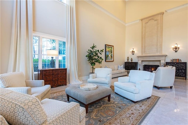 living room with a large fireplace and a high ceiling