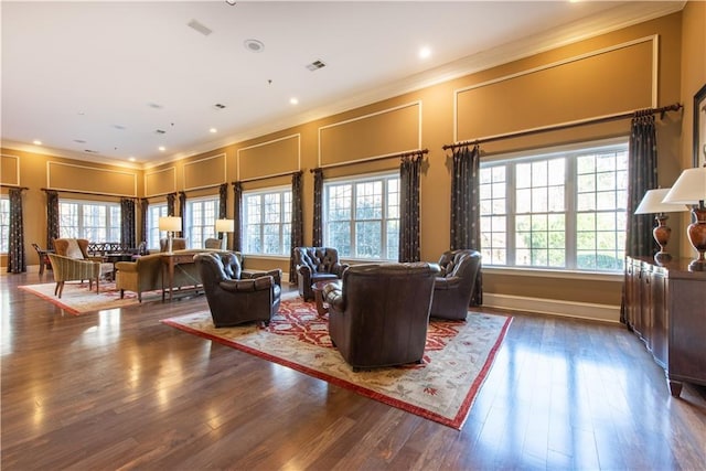 living room with crown molding and dark hardwood / wood-style floors