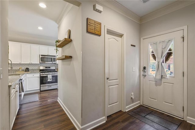 1244 Harris Commons Pl, Roswell, GA 30076 - foyer entrance featuring dark wood-style floors, ornamental molding, and recessed lighting