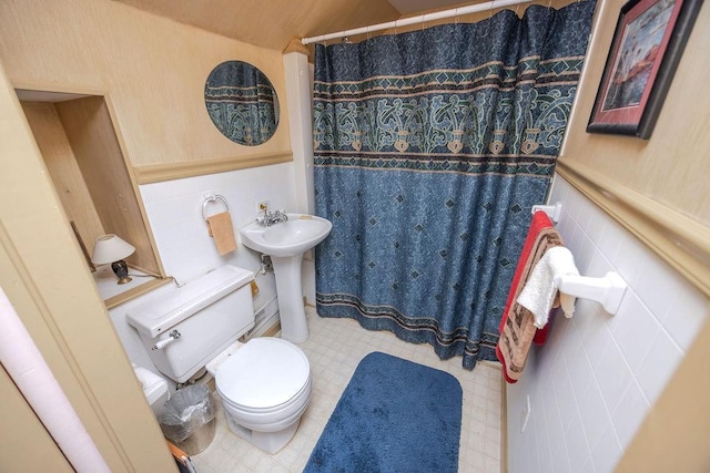 970 E Main St, Canton, GA 30114 - full bath with a wainscoted wall, toilet, a sink, a shower with curtain, and tile patterned floors
