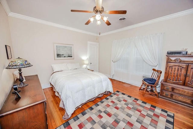 970 E Main St, Canton, GA 30114 - bedroom featuring light wood-style floors, visible vents, crown molding, and a ceiling fan