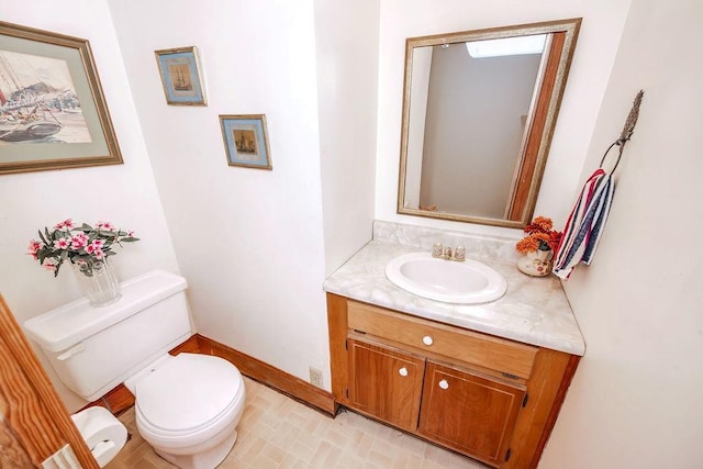 970 E Main St, Canton, GA 30114 - bathroom featuring toilet, baseboards, and vanity