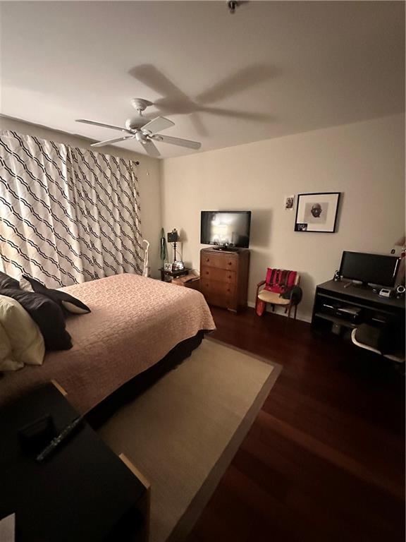200 Renaissance Pkwy NE Unit 305, Atlanta, GA 30308 - bedroom featuring wood finished floors and ceiling fan