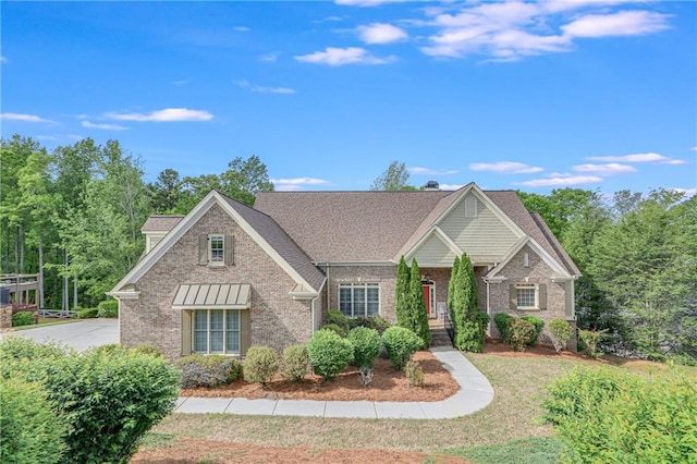 craftsman-style home with brick siding