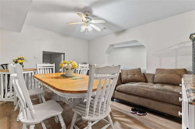 dining room featuring ceiling fan and light hardwood / wood-style floors